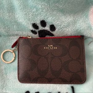 Selling a small coach coin purse.